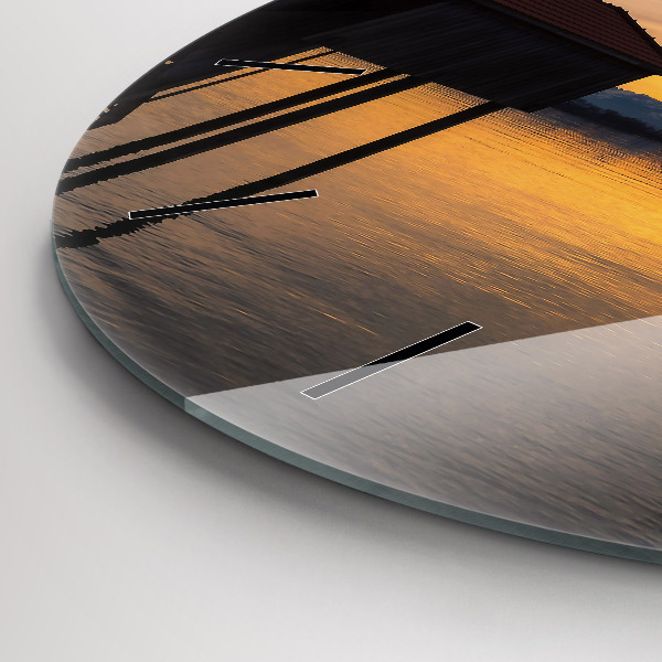 Round glass clock Sunset over the lake