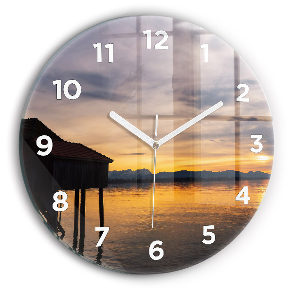 Round glass clock Sunset over the lake