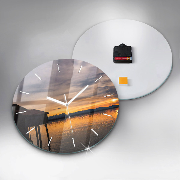 Round glass clock Sunset over the lake