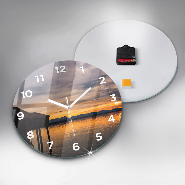 Round glass clock Sunset over the lake