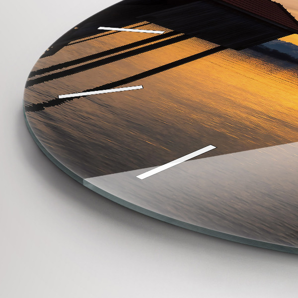 Round glass clock Sunset over the lake