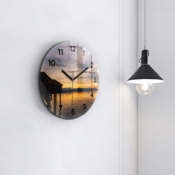 Round glass clock Sunset over the lake