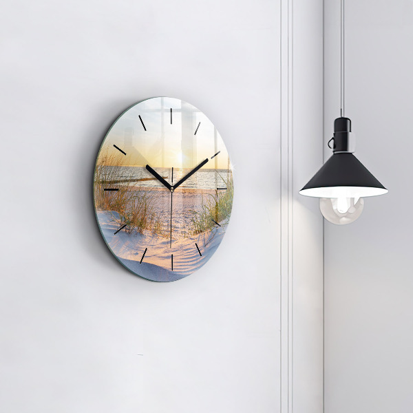Round glass clock Sunset over the sea