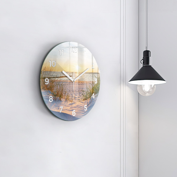 Round glass clock Sunset over the sea
