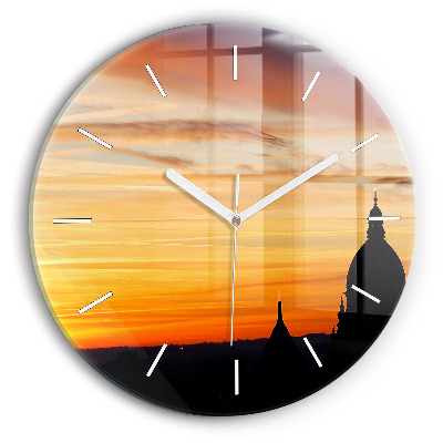 Round glass clock Building and sunset