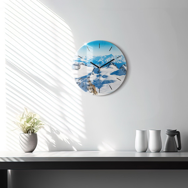 Round glass clock Skier in the Alps