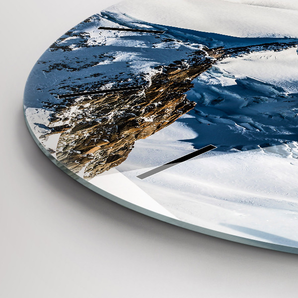 Round glass clock Skier in the Alps
