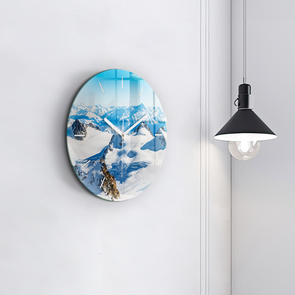 Round glass clock Skier in the Alps