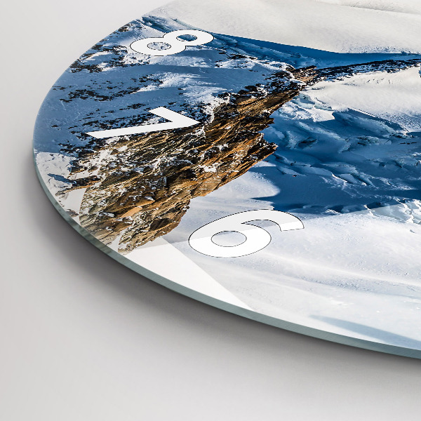 Round glass clock Skier in the Alps