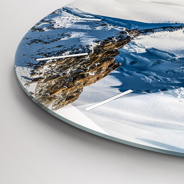 Round glass clock Skier in the Alps