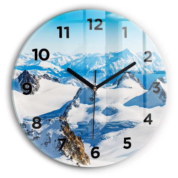 Round glass clock Skier in the Alps