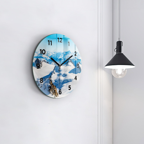 Round glass clock Skier in the Alps