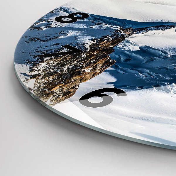 Round glass clock Skier in the Alps