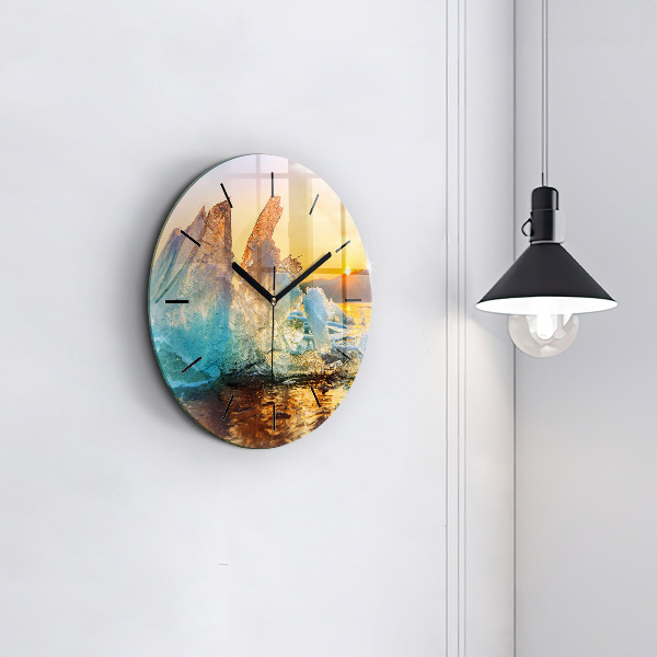 Round glass clock Iceberg and sunrise