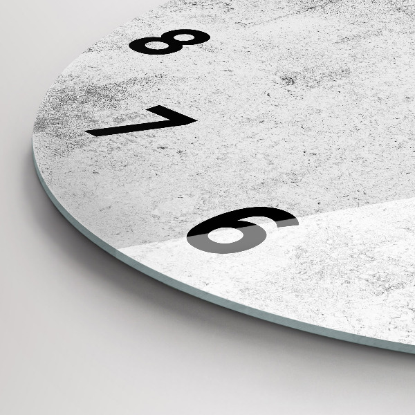 Round glass clock Concrete wall