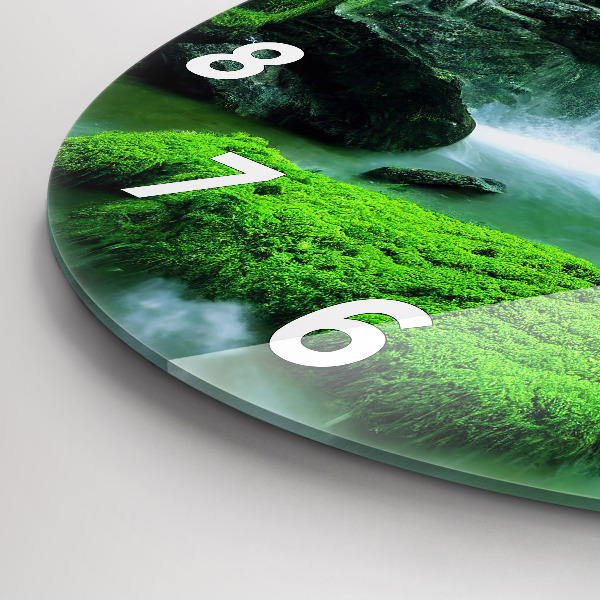 Round glass clock Waterfall among the moss