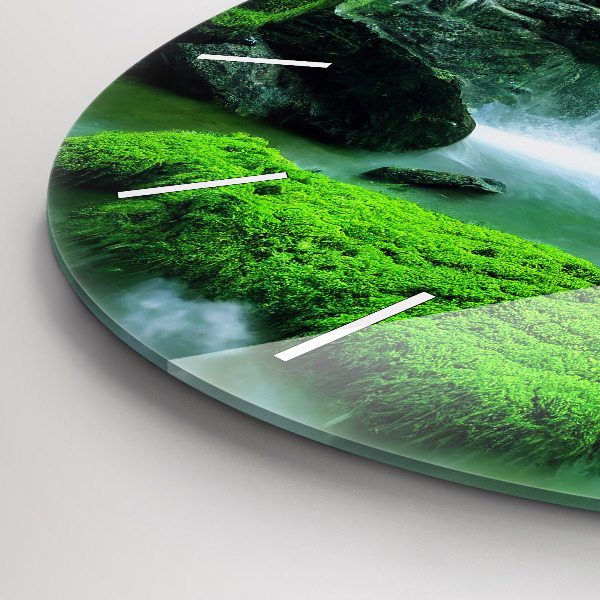 Round glass clock Waterfall among the moss