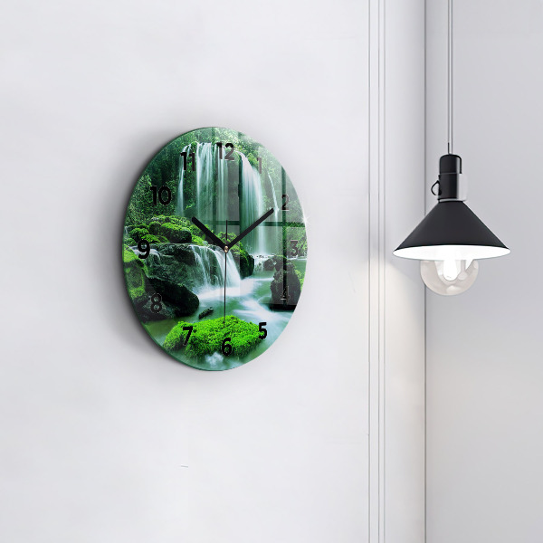 Round glass clock Waterfall among the moss