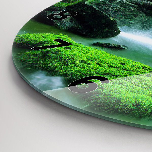 Round glass clock Waterfall among the moss