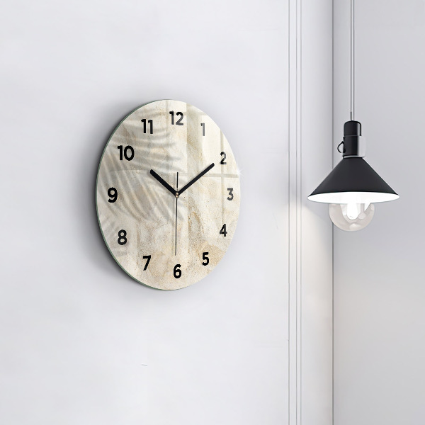 Round glass clock Palm tree shadow sand