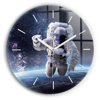 Round glass clock Astronaut above the earth