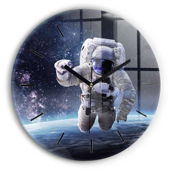 Round glass clock Astronaut above the earth