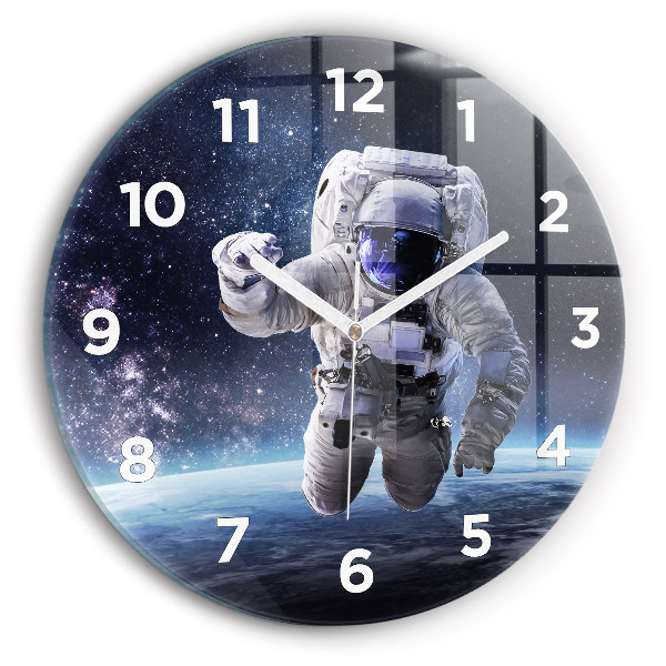 Round glass clock Astronaut above the earth