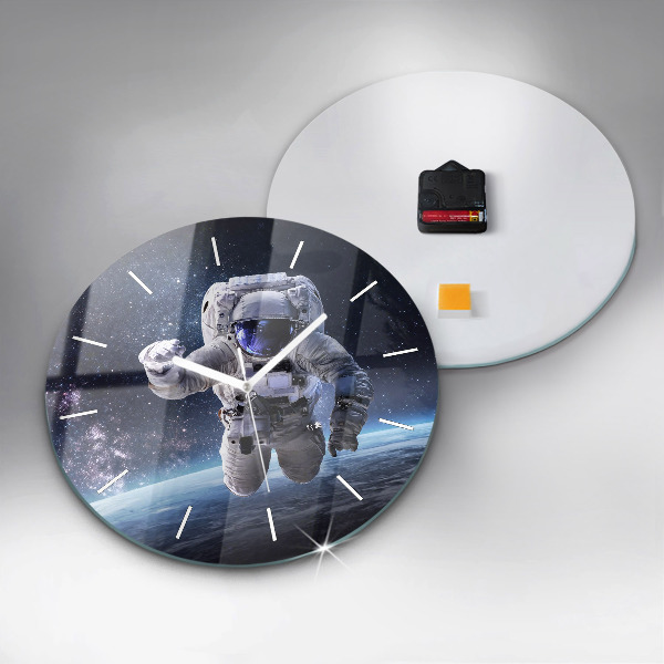Round glass clock Astronaut above the earth