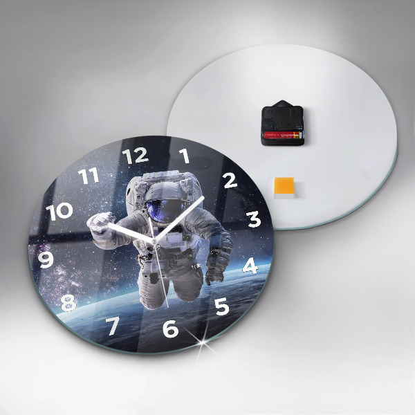 Round glass clock Astronaut above the earth