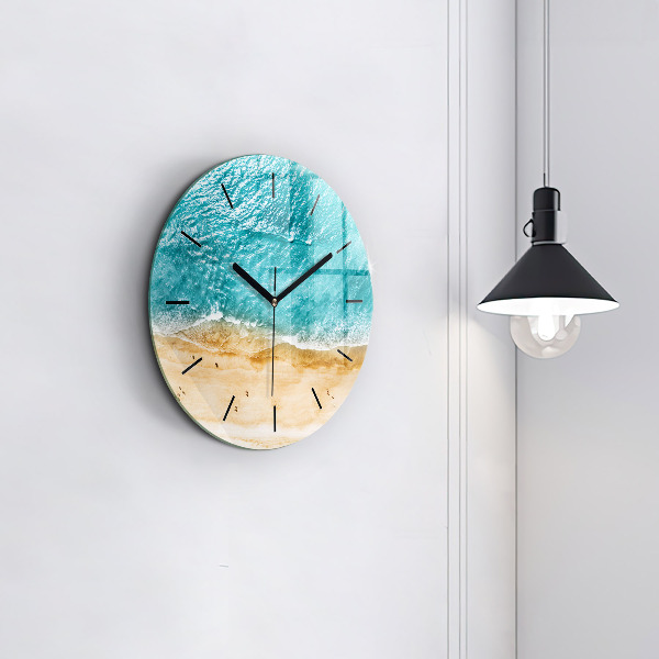 Round glass clock sea beach people