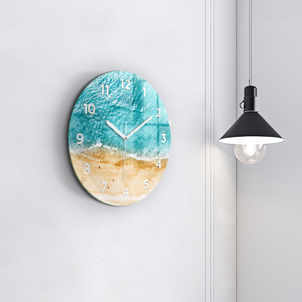 Round glass clock sea beach people