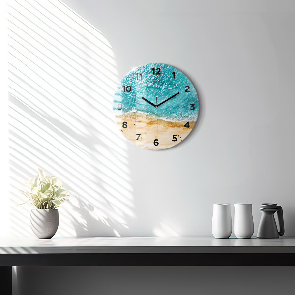 Round glass clock sea beach people