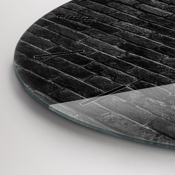 Round glass clock Dark brick wall