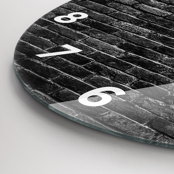 Round glass clock Dark brick wall