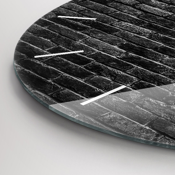 Round glass clock Dark brick wall