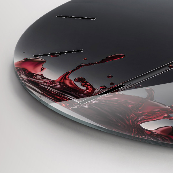 Round glass clock A glass of red wine