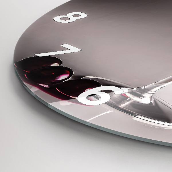 Round glass clock A glass of red wine