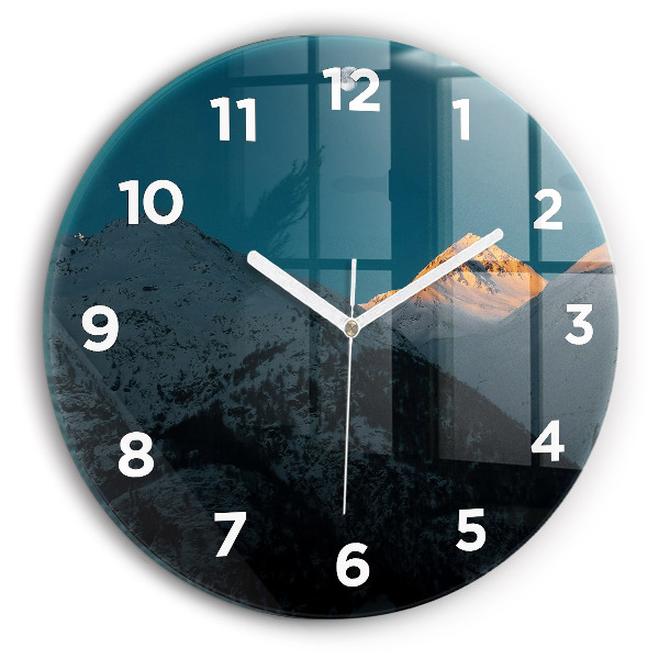 Round glass clock Sunset in the mountains
