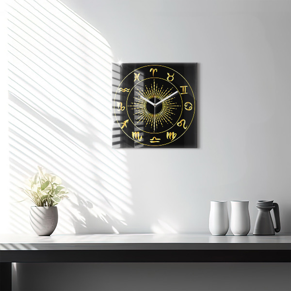 Square glass clock Golden zodiac signs on black background