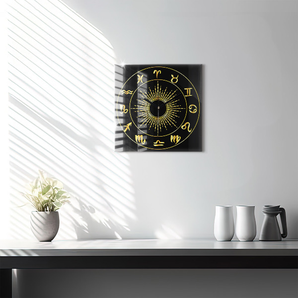 Square glass clock Golden zodiac signs on black background