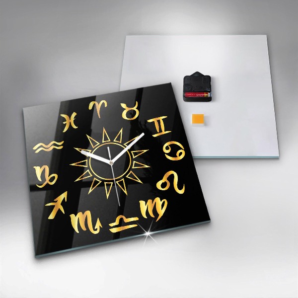 Square glass clock Golden astrological signs on black background