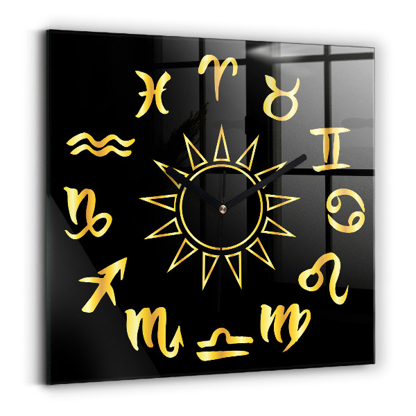 Square glass clock Golden astrological signs on black background