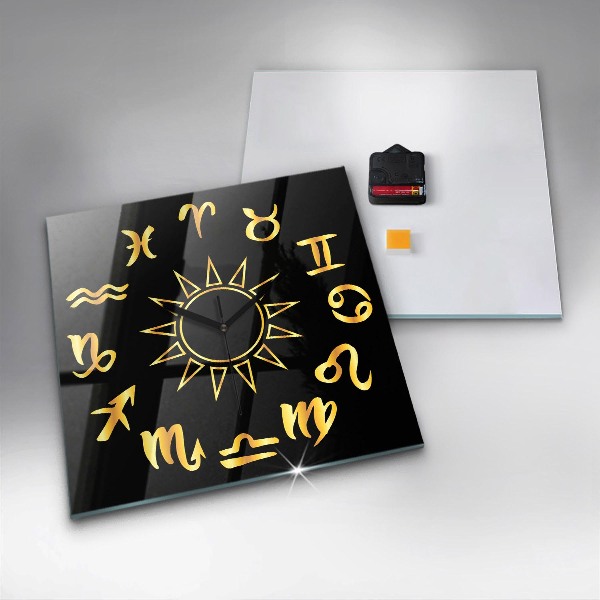 Square glass clock Golden astrological signs on black background